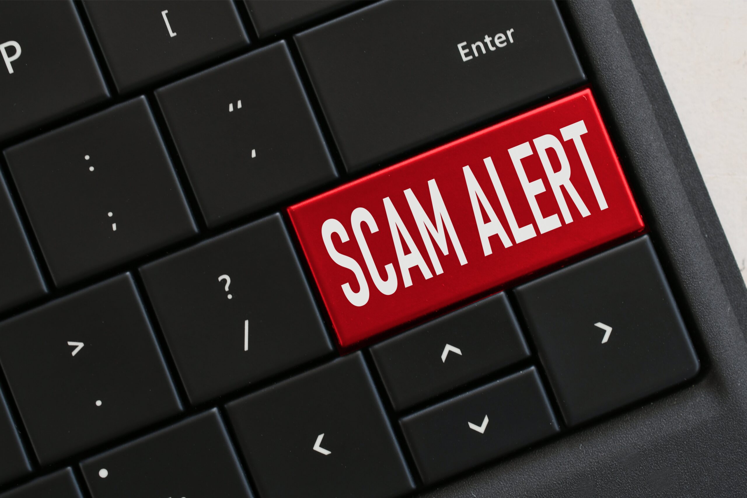 Suspicious water or energy bill - image showing a keyboard with Scam Alert replacing the enter key